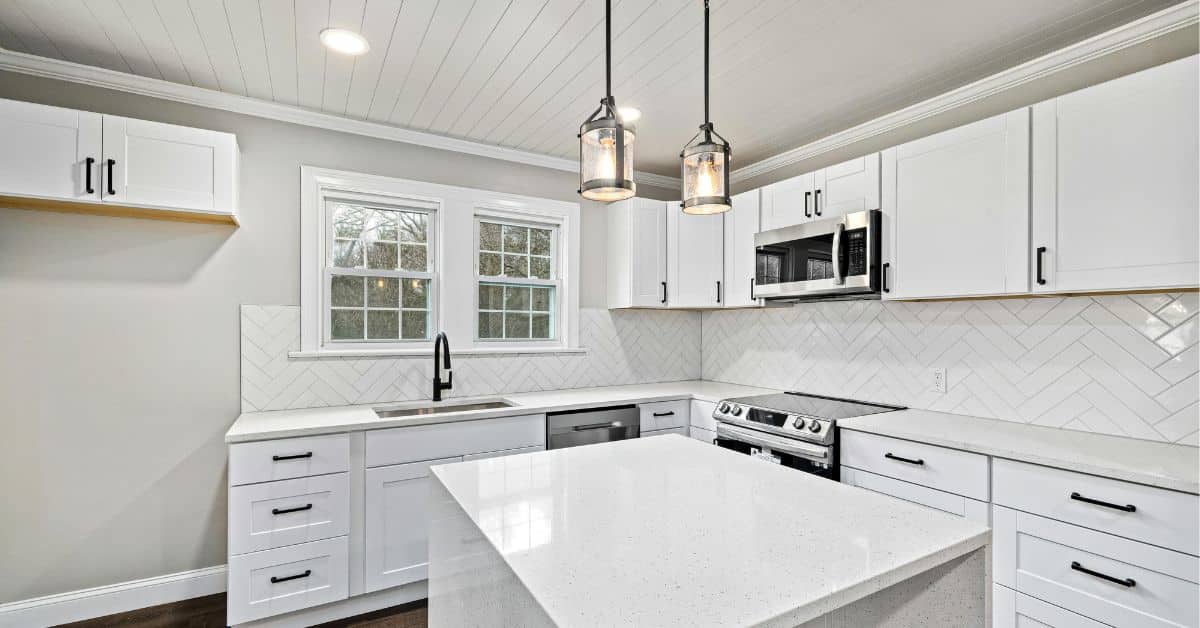 Contemporary Kitchen Remodeling Port St. Lucie Contemporary kitchen remodeling in Port St. Lucie with white cabinets and modern lighting