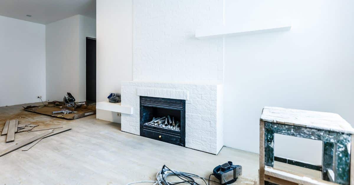 Modern Fireplace Upgrade in Split Level Remodel Modern fireplace upgrade during a split level home renovation with new white interior design.