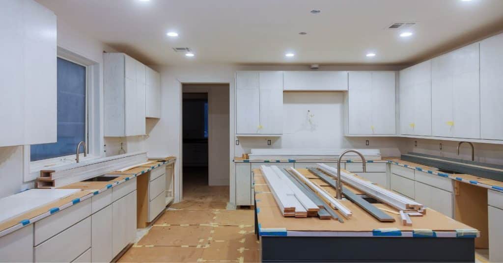 Split level home kitchen remodel in progress with custom cabinetry installation by We Rack Designs.
